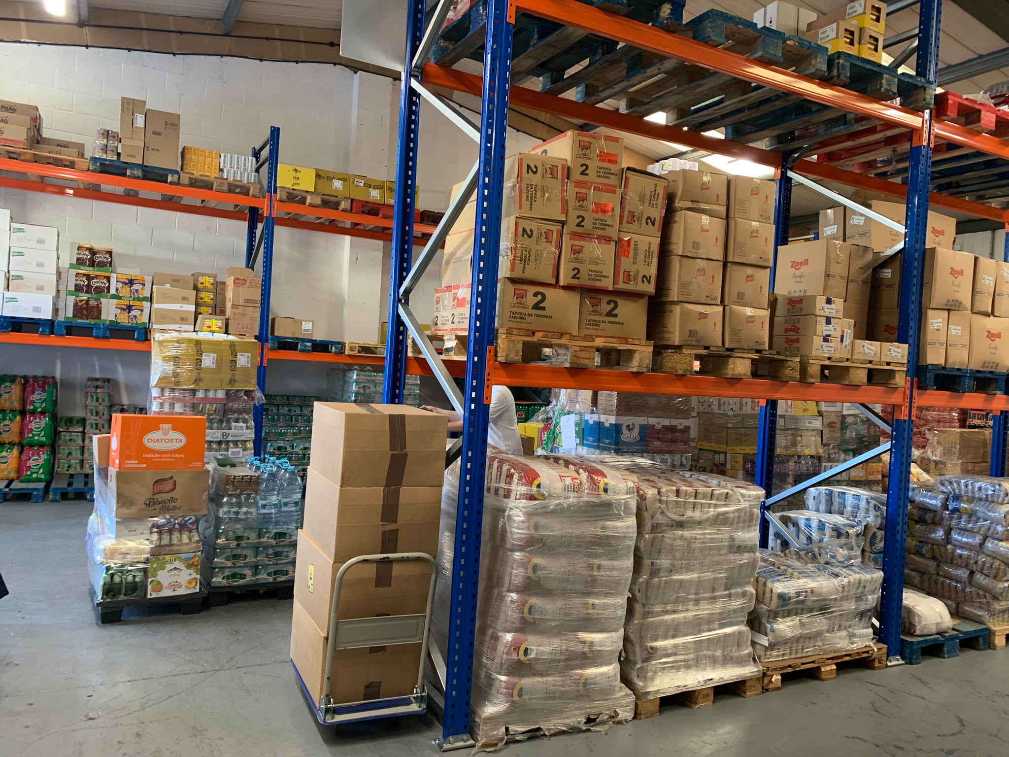 Connect Foods warehouse racking stocked with palletised food products